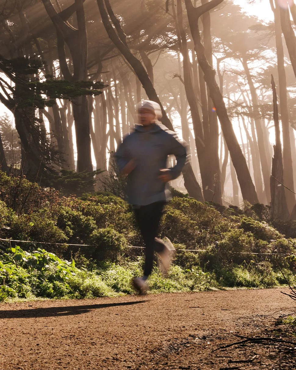 Daniel He running through forest