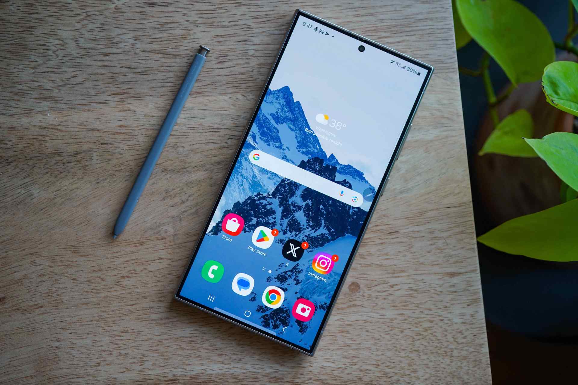 a samsung galaxy phone on a desk with a pencil