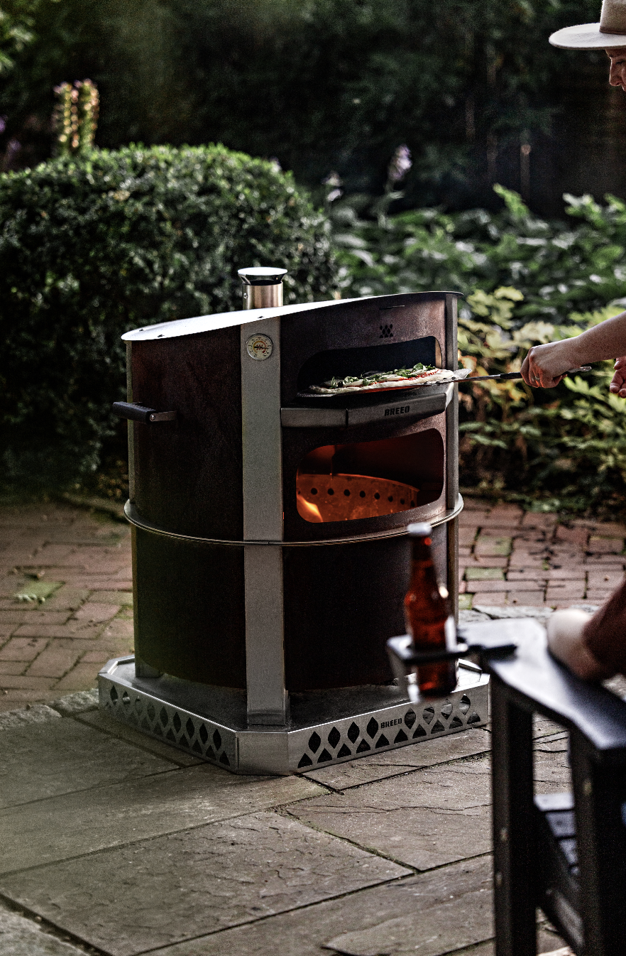 breo live fire pizza oven in use