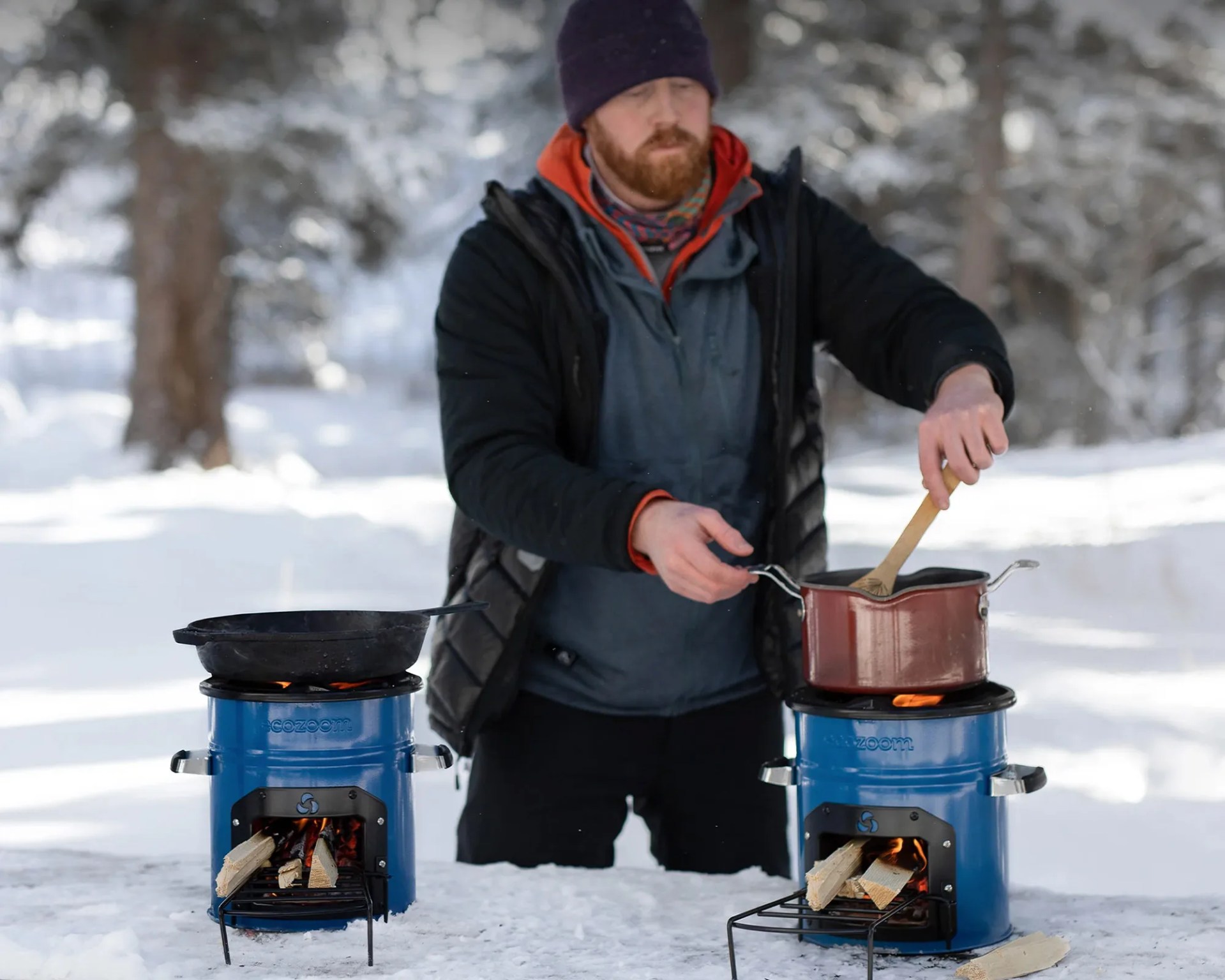 man using BioLite EcoZoom Dura Portable Wood Burning Stove
