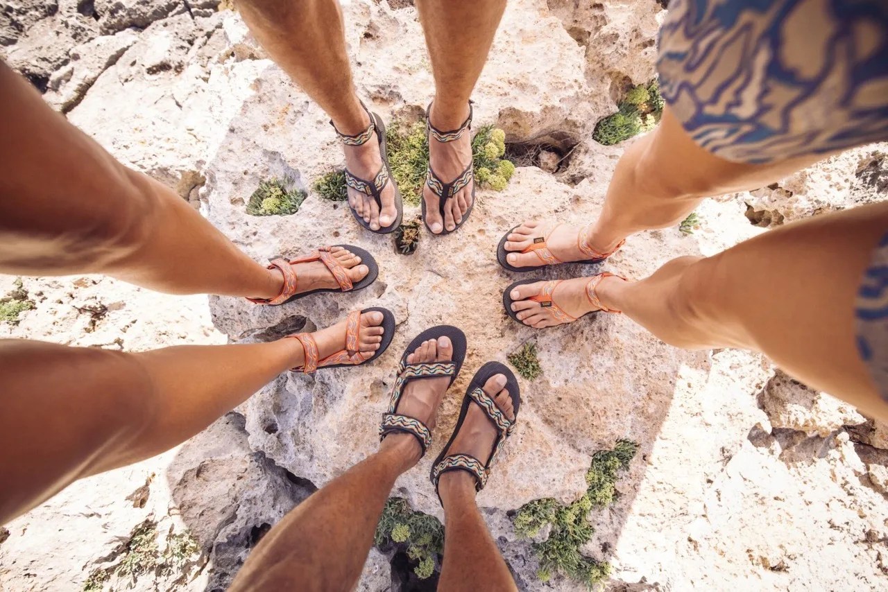 group of hikers in teva sandals from throughout the decades