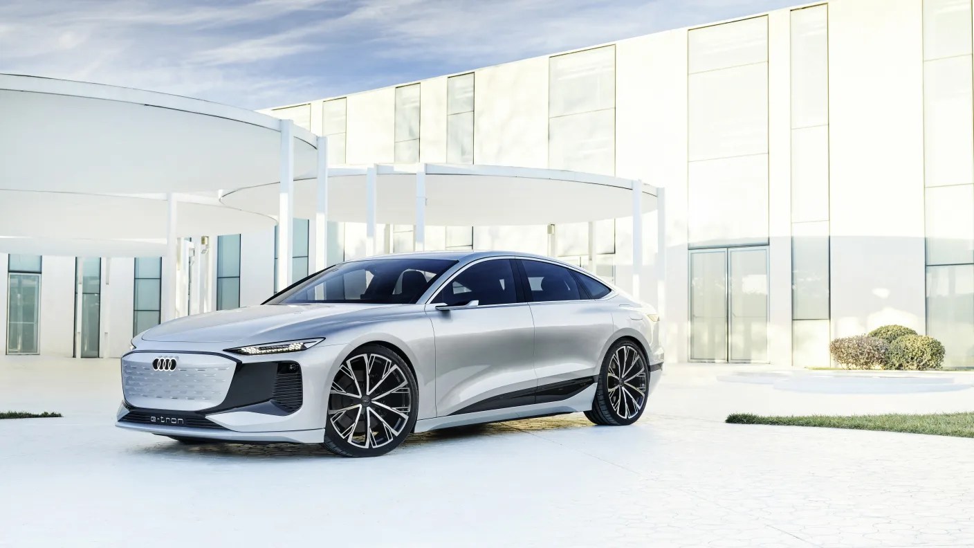audi a6 e tron concept car in a futuristic garden