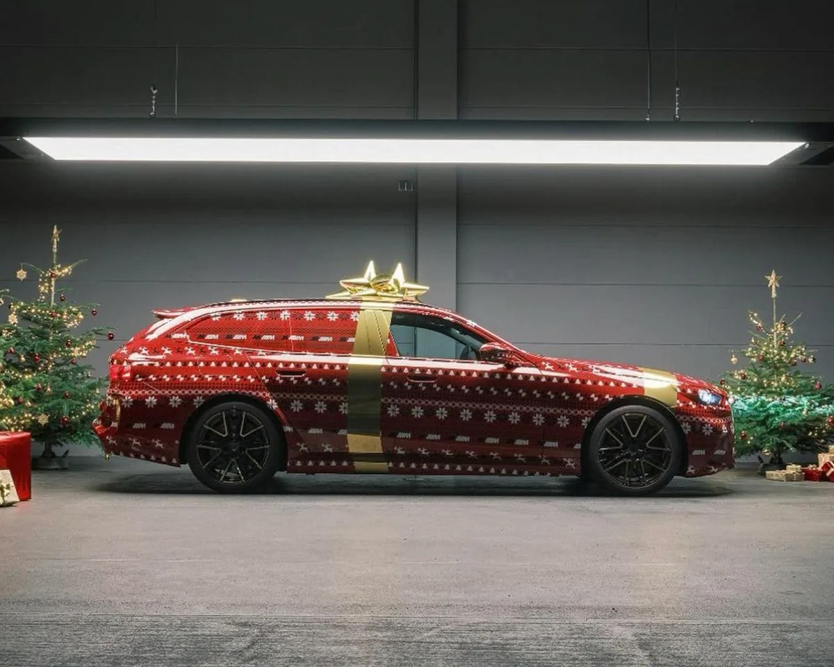 side view of bmw m5 station wagon wrapped like a christmas present