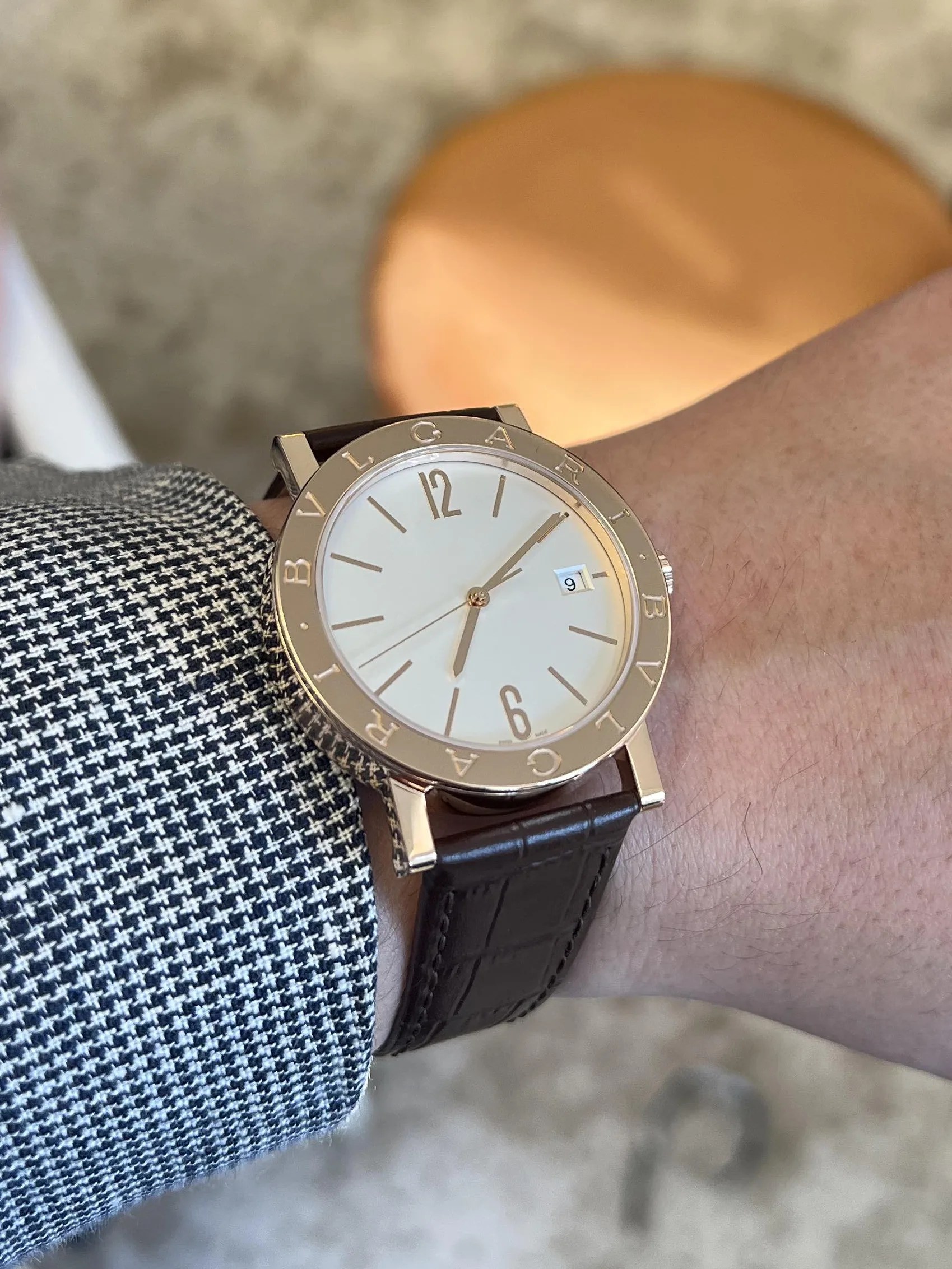 gold watch on wrist