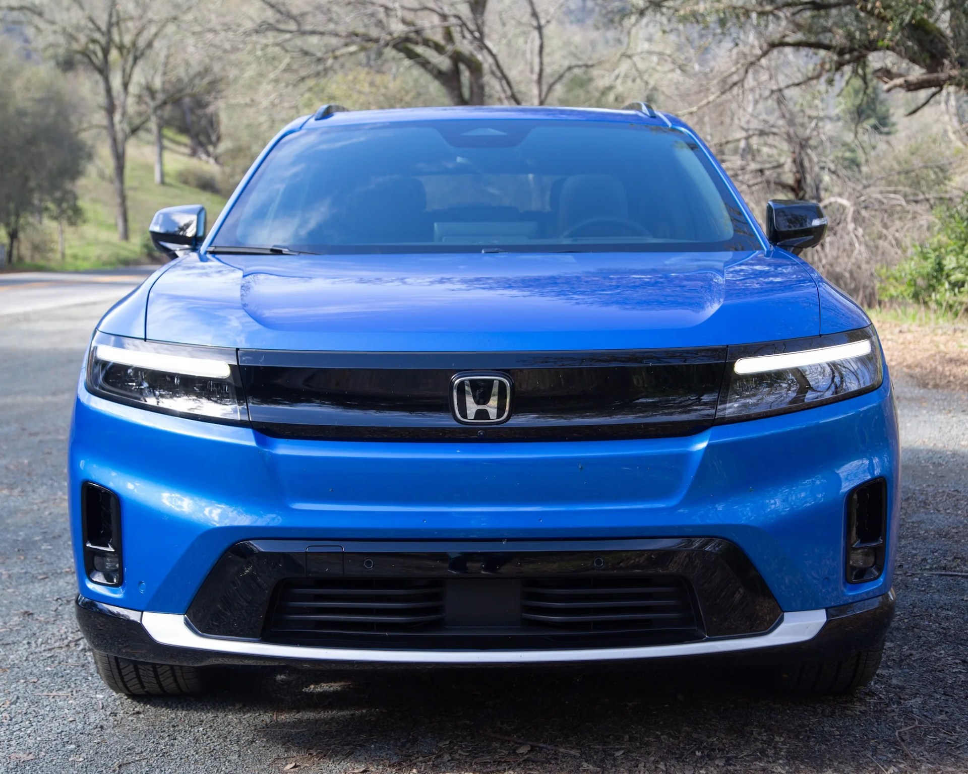 the front end of a blue 2024 honda prologue