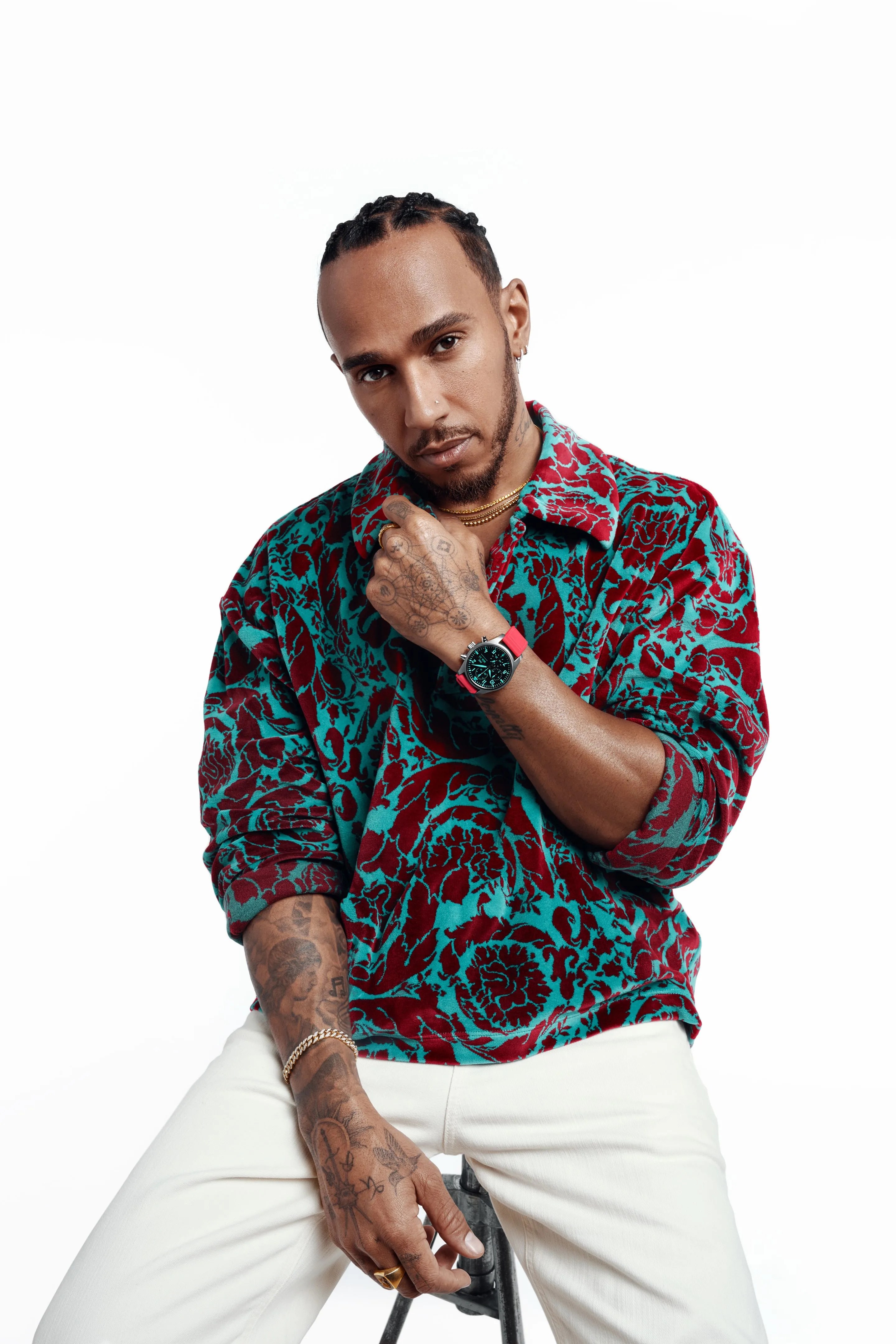 f1 driver lewis hamilton poses with an iwc watch