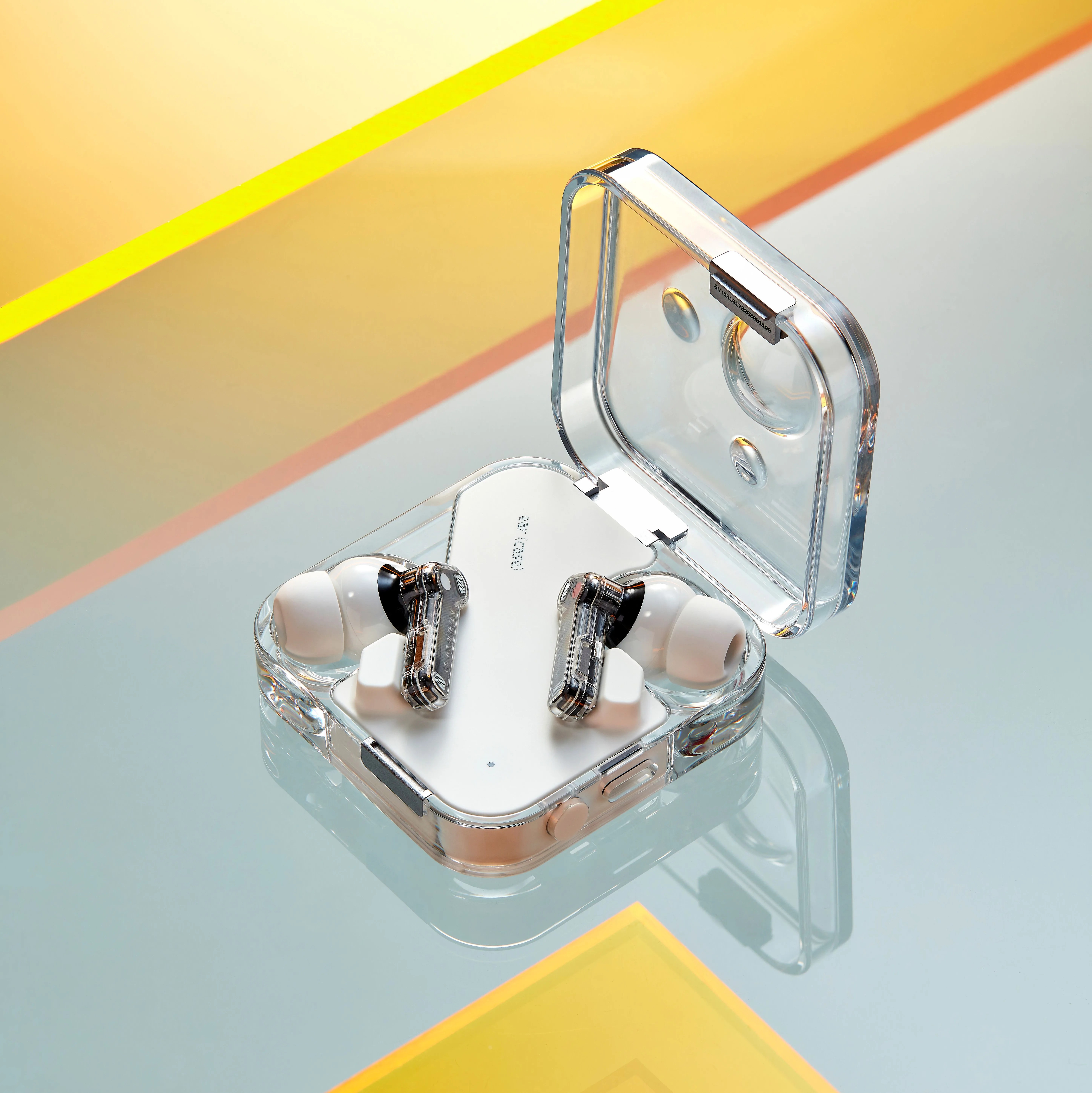transparent ear buds in a case
