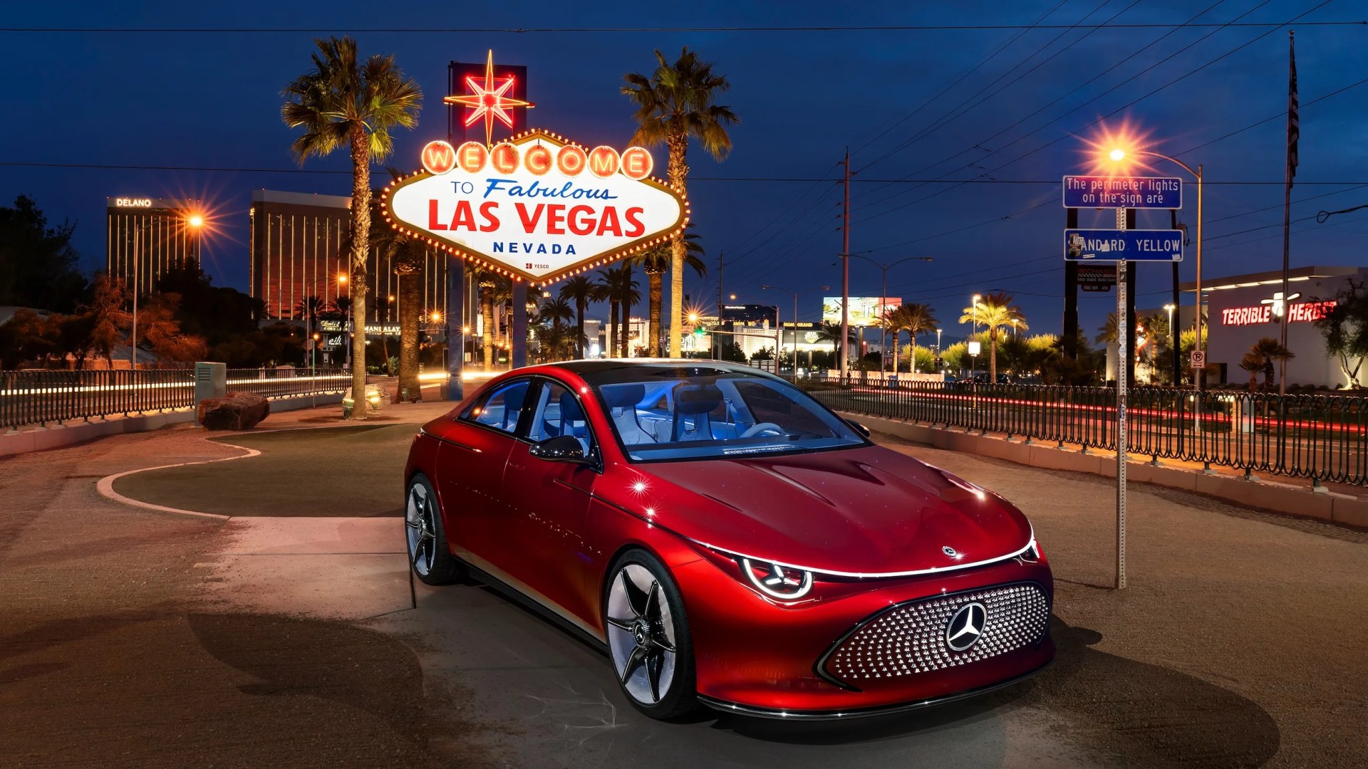 the mercedes benz concept cla class parked in front of the las vegas sign