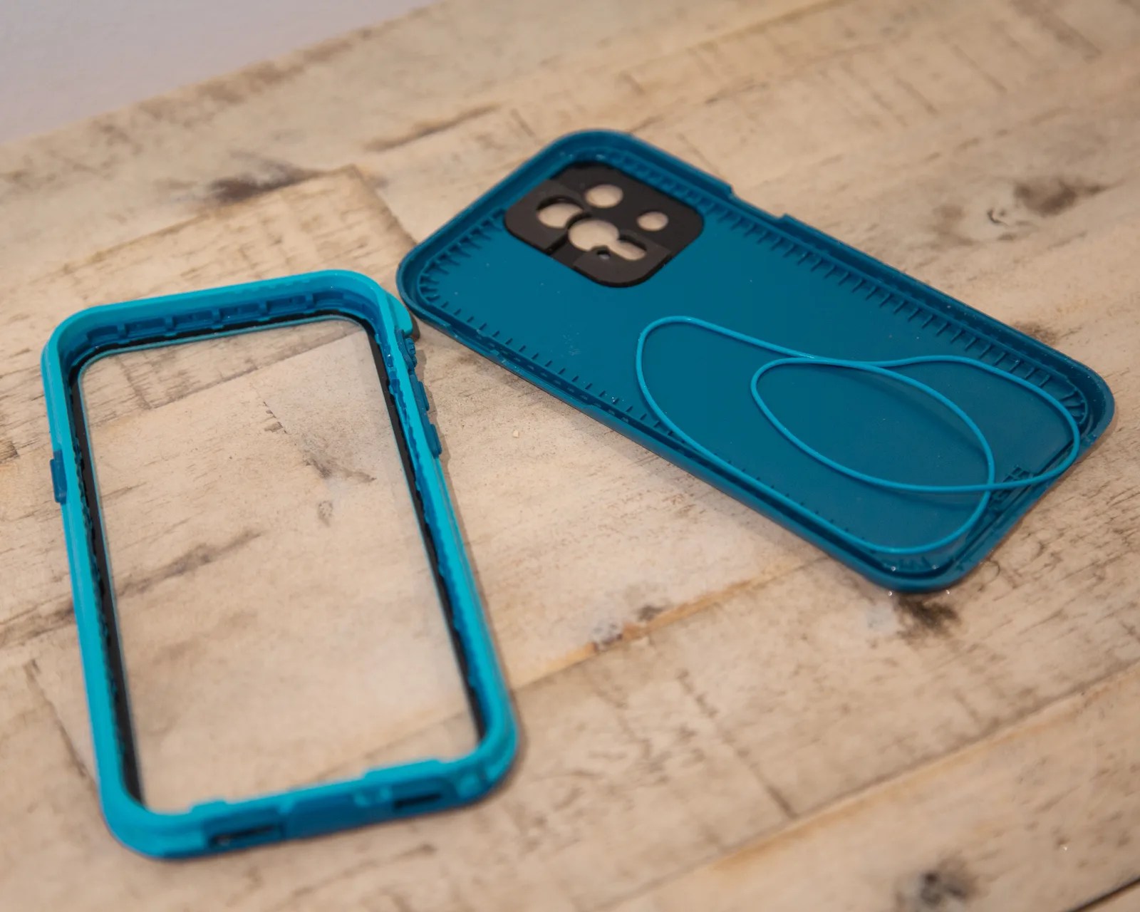 green otterbox lifeproof fre case open to reveal its parts