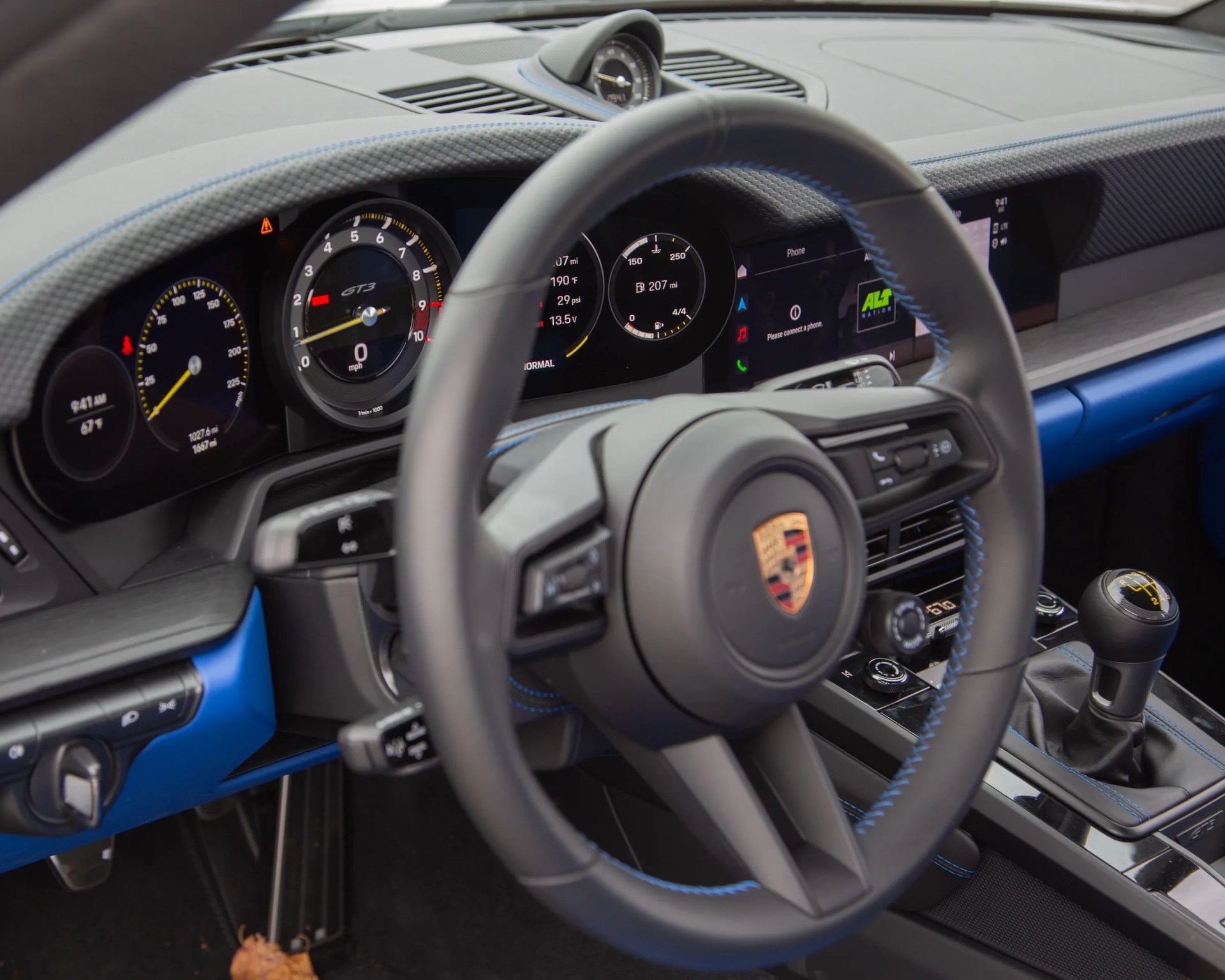 dashboard and steering wheel of a porsche 911 gt3 touring