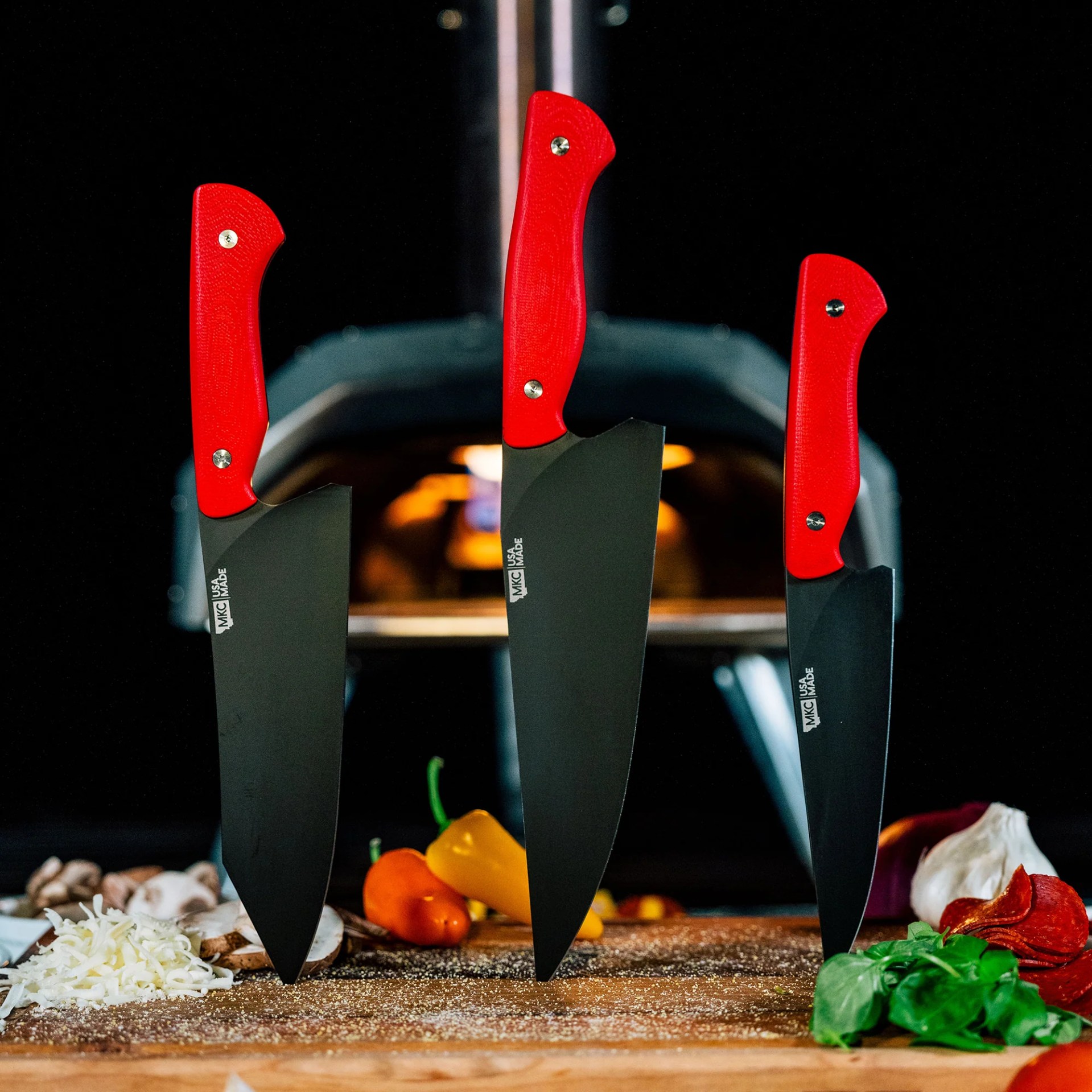 The MKC 3-Piece Collection in red and black in a kitchen
