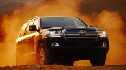 2020 toyota land cruiser climbing an off road hill with dust being kicked up