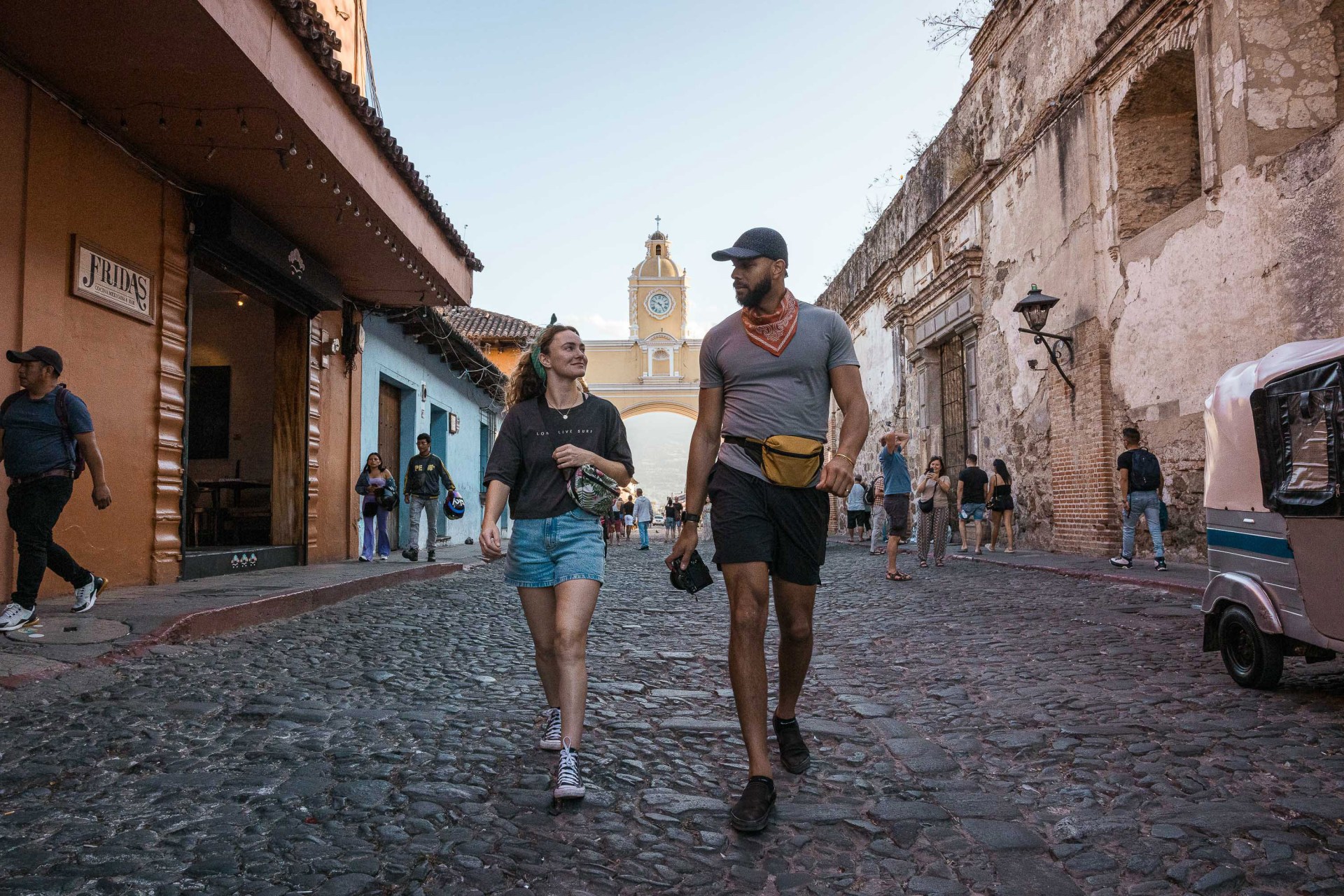 man and woman walking the streets carrying nomadix The Carry-All Essential