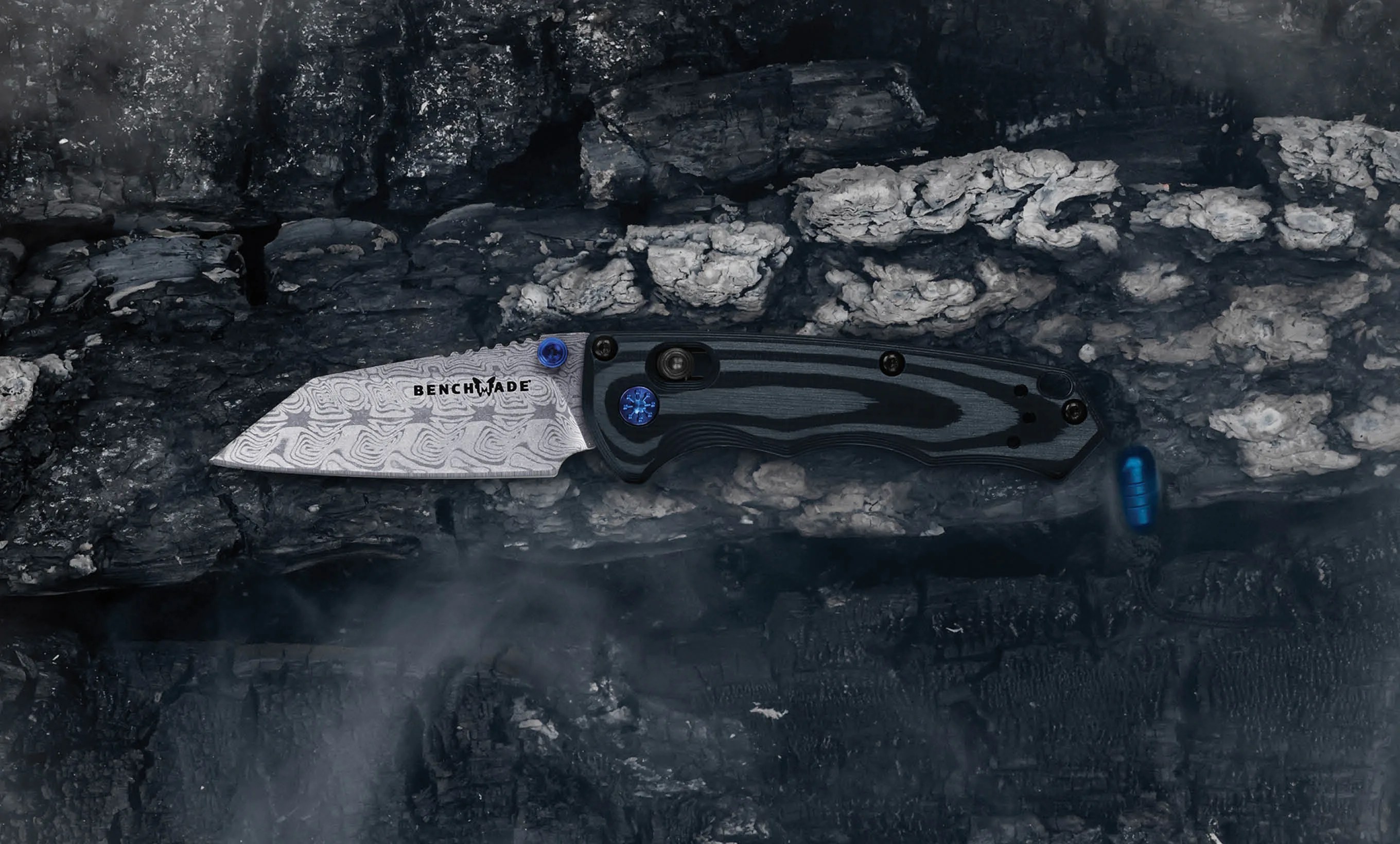 benchmade gold class full immunity on charred and smokey background