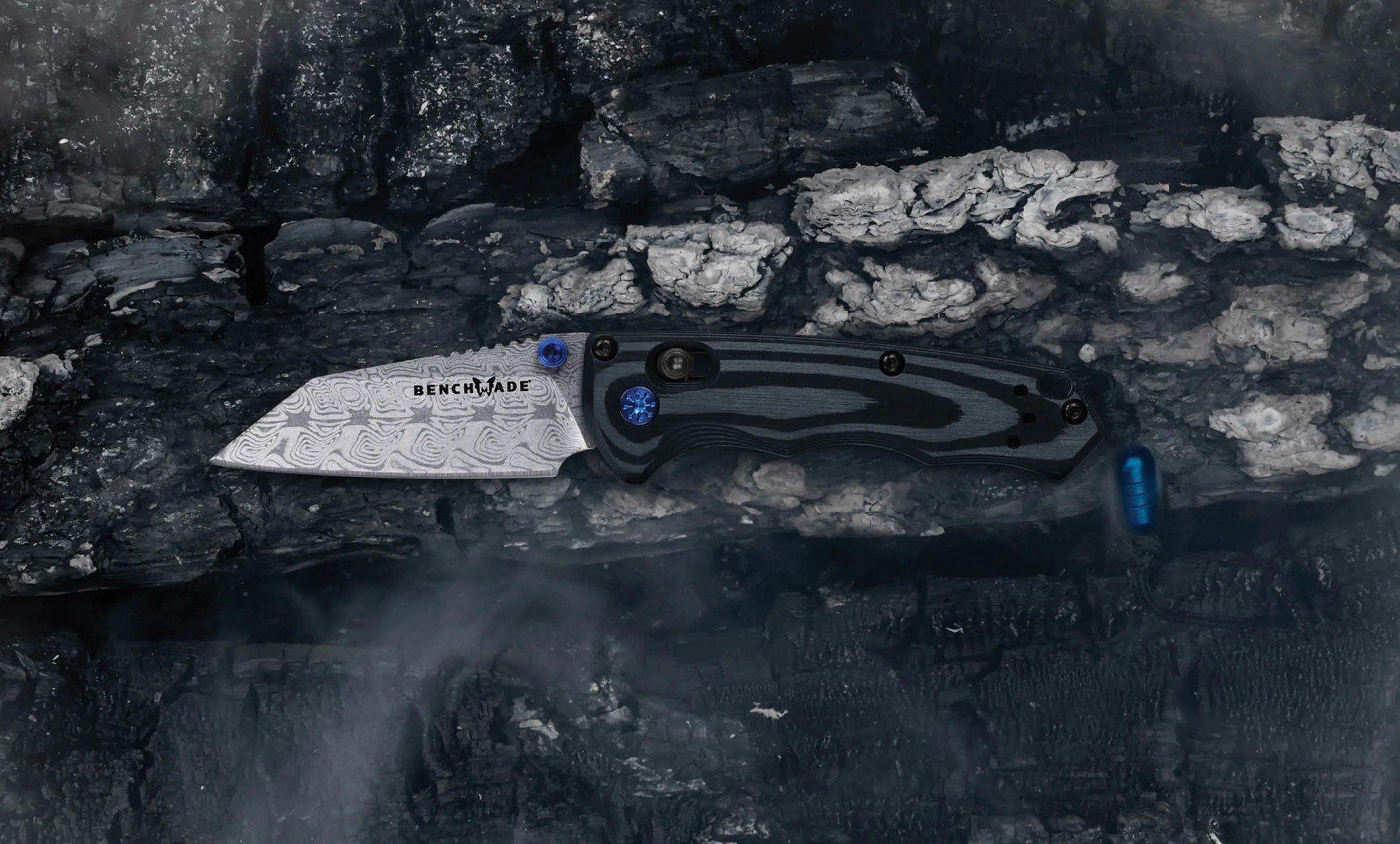 benchmade gold class full immunity on charred and smokey background