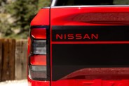 tailgate of a red nissan frontier pickup truck