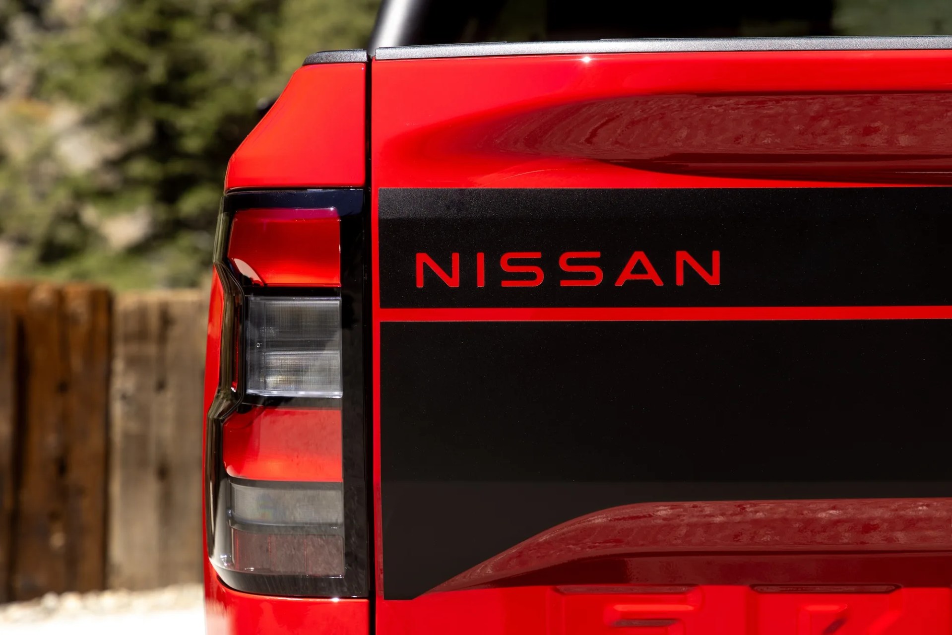 tailgate of a red nissan frontier pickup truck