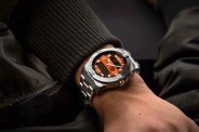 breitling analog digital watch on mans wrist