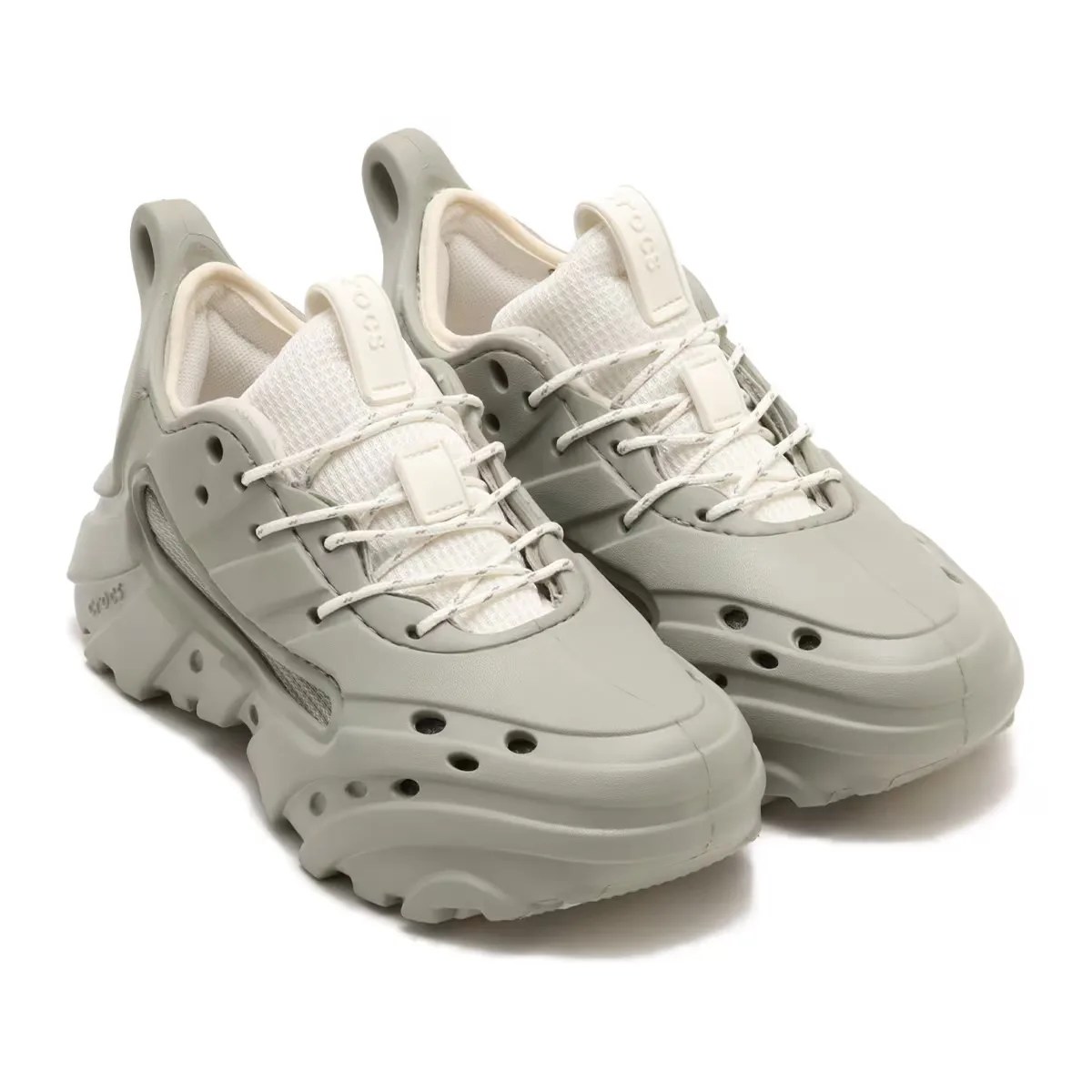 Pair of Crocs Nova Trek sneakers in grey facing diagonally from left to right.