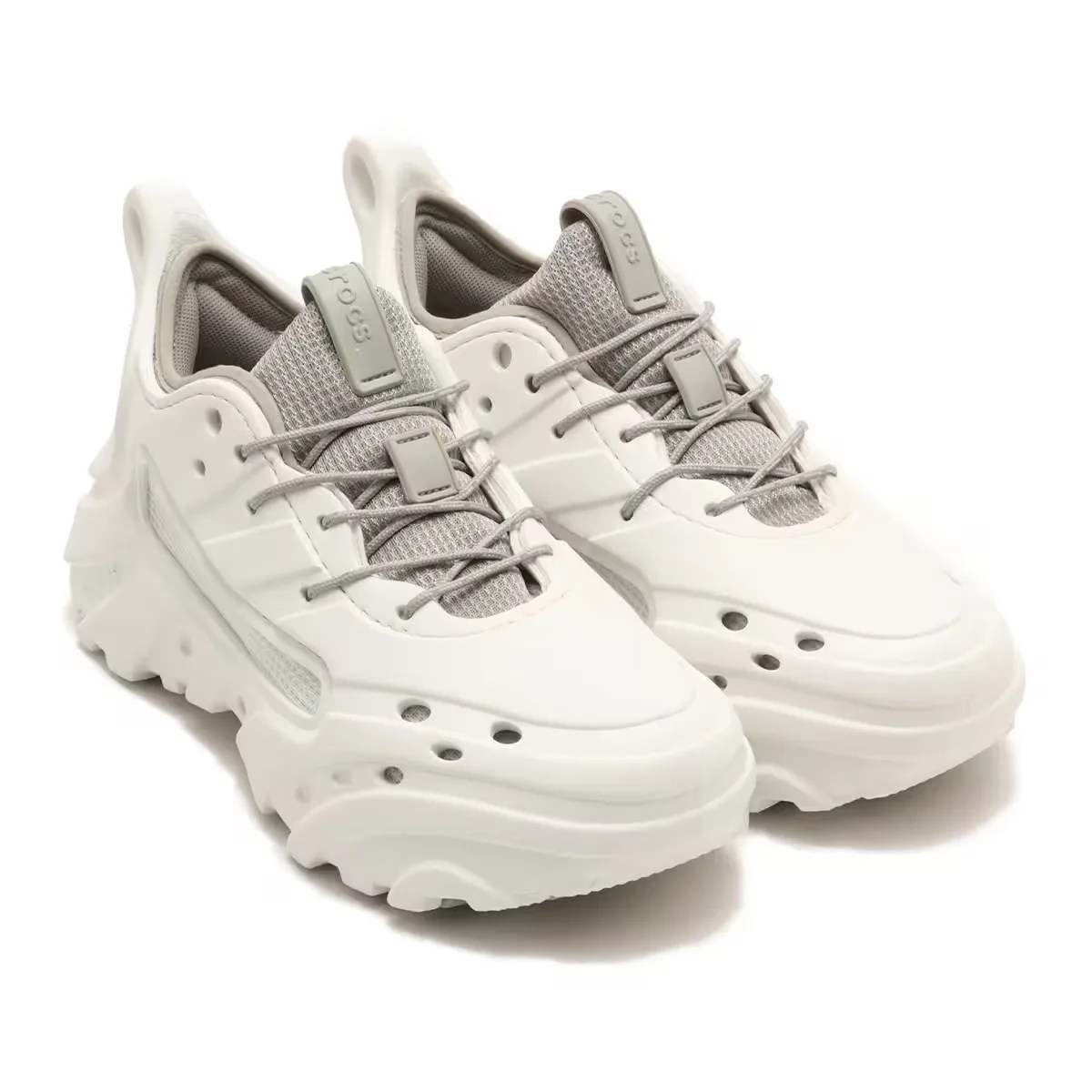 Pair of white Crocs Nova Trek sneakers resting at an angle