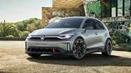 Electric Volkswagen Gofl GTI parked in front of a fancy house with graffiti