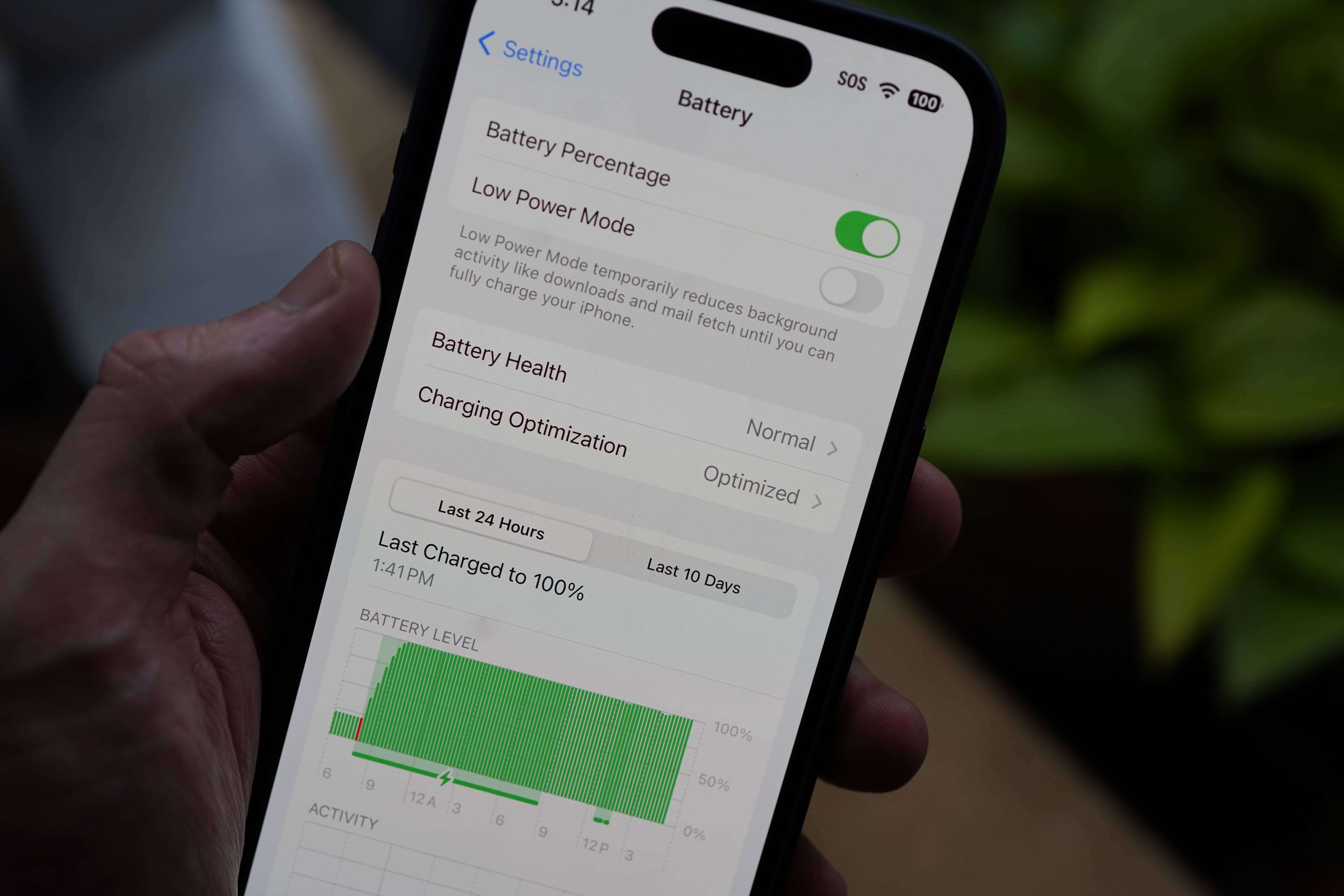 An iPhone 15 screen displays the phones battery health with the new iOS 17.4