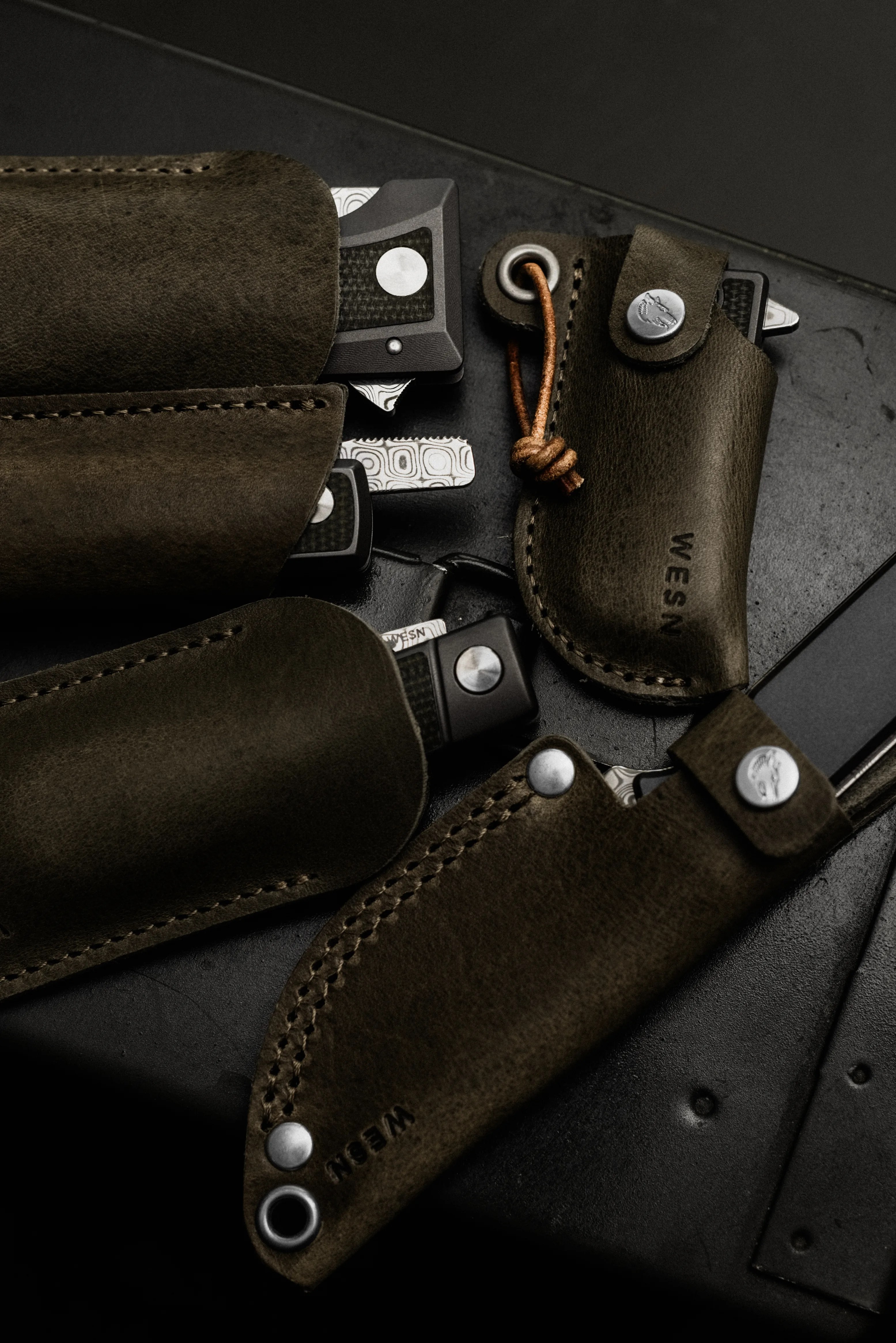 wesn founder's line sheaths on black surface