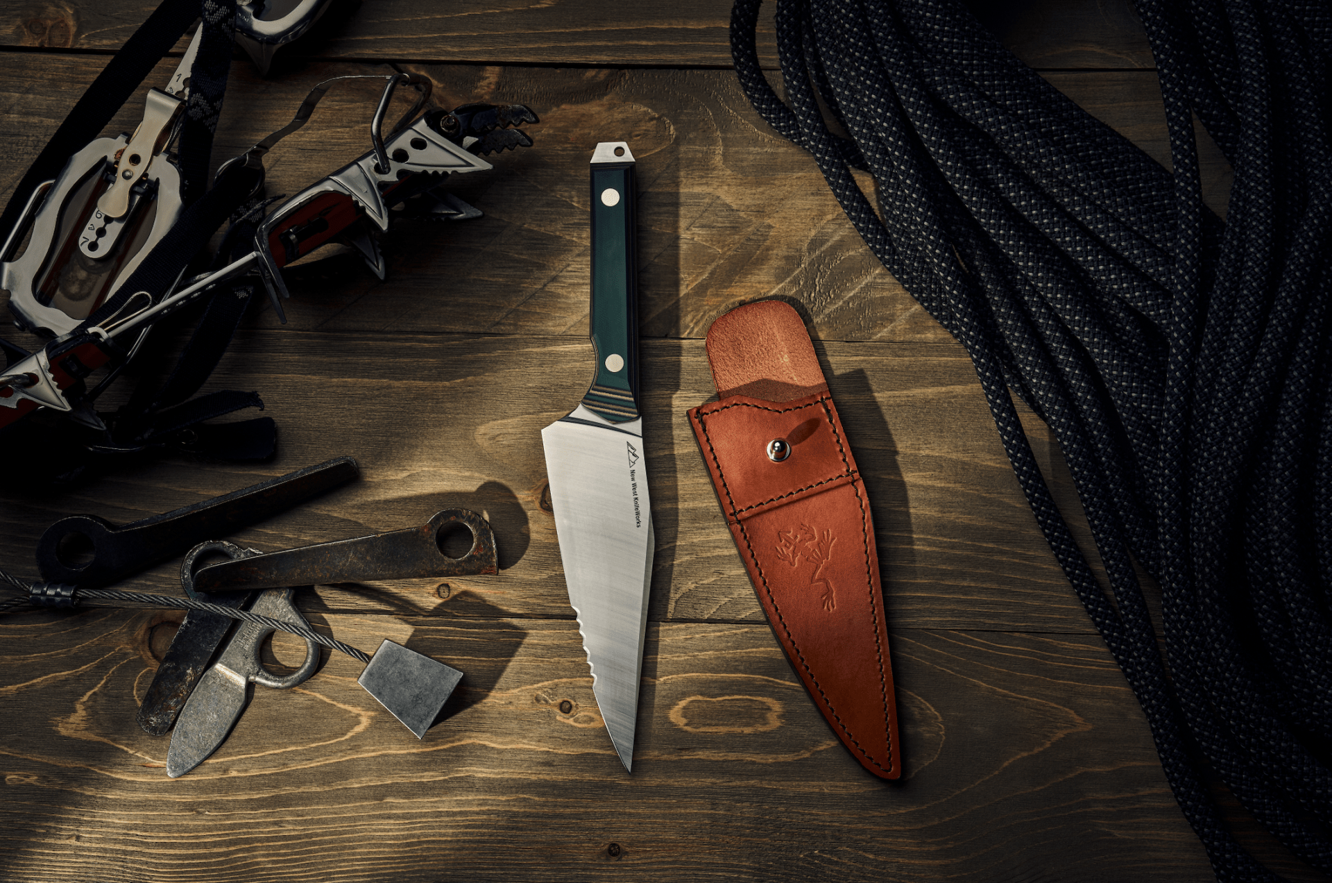 new west knife works jack carr collaboration knife on table with sheath
