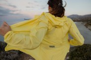 woman running in yellow running jacket