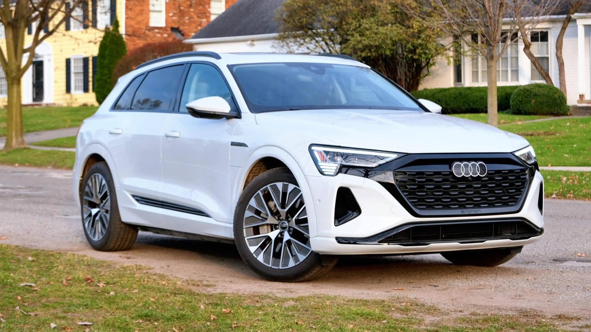 Audi Q8 E-Tron parked on the side of a street