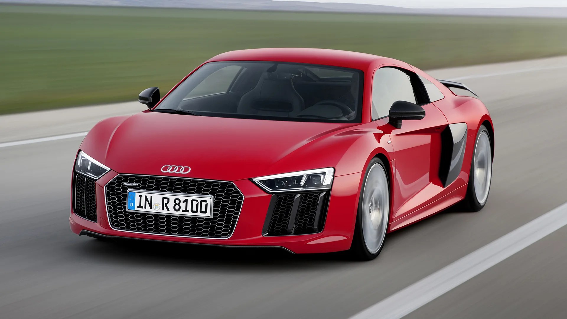 red audi r8 sports car driving on a track
