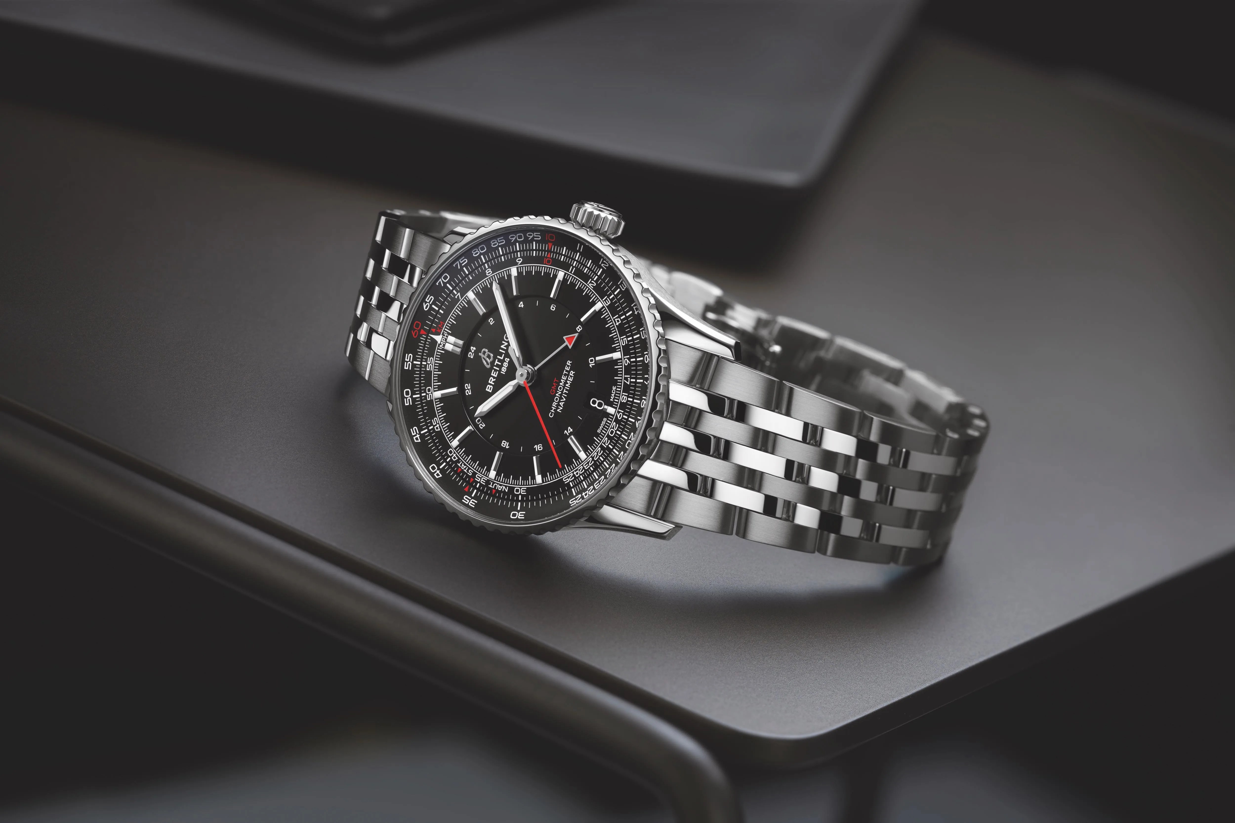 breitling gmt watch on black background
