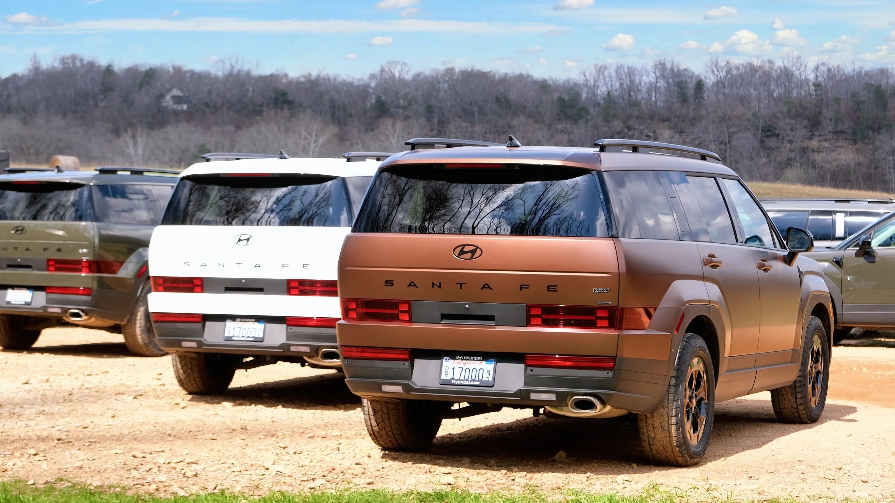 Group of hyundai santa fe suvs in a line