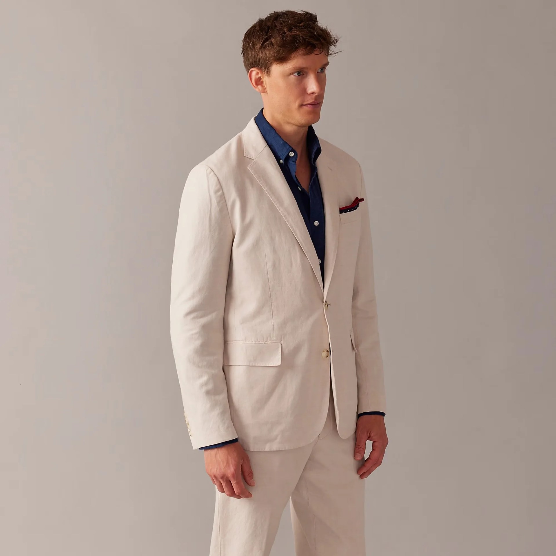 man wearing a beige suit