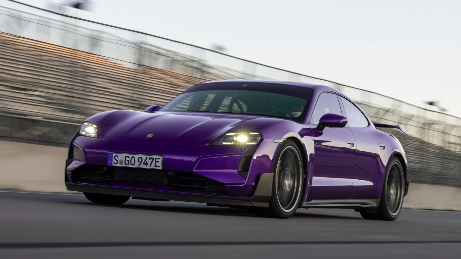 porsche taycan turbo gt in purple on a race track