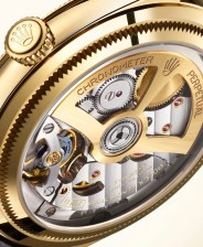 closeup of rolex watch movement seen through caseback