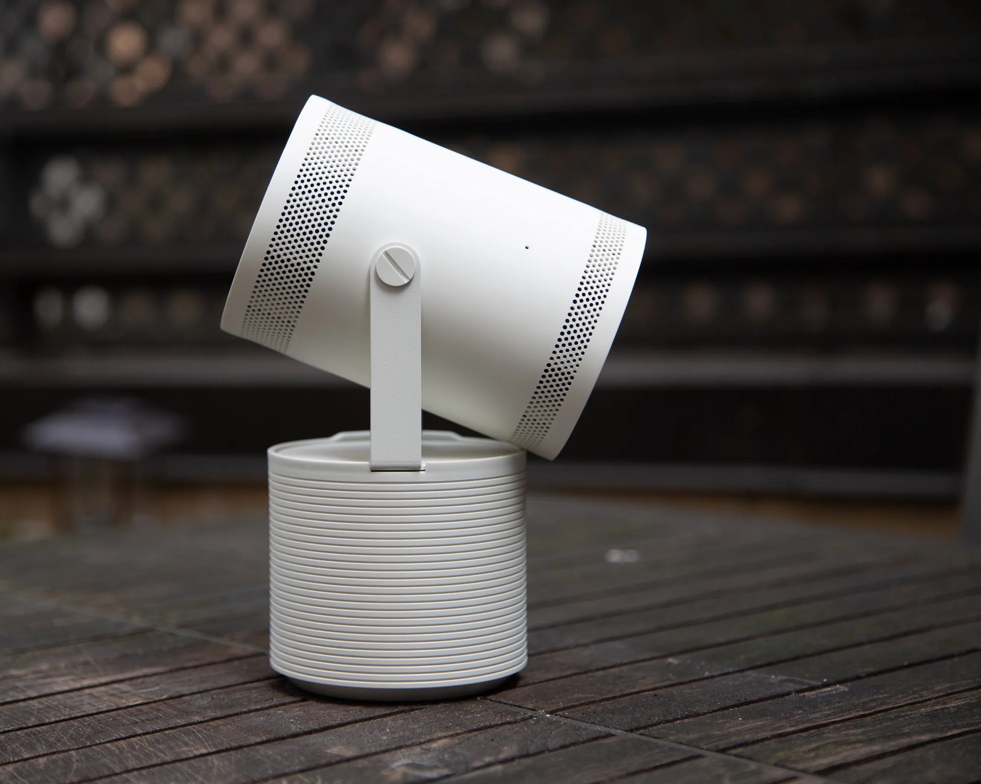 white samsung freestyle projector facing down at maximum angle as seen from the side