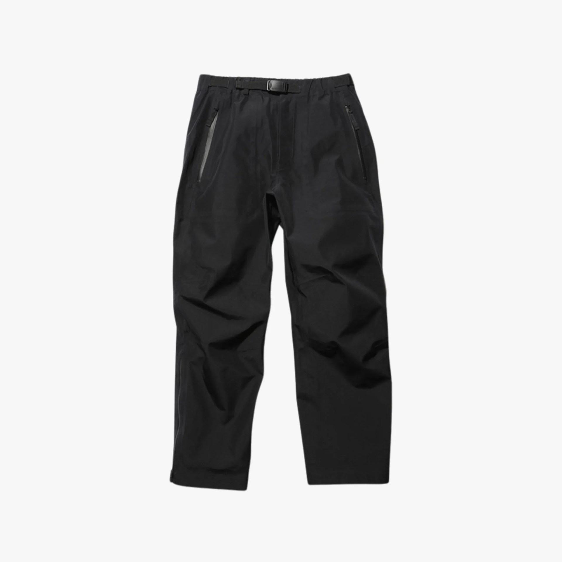 snow peak gore tex rain pants on grey background