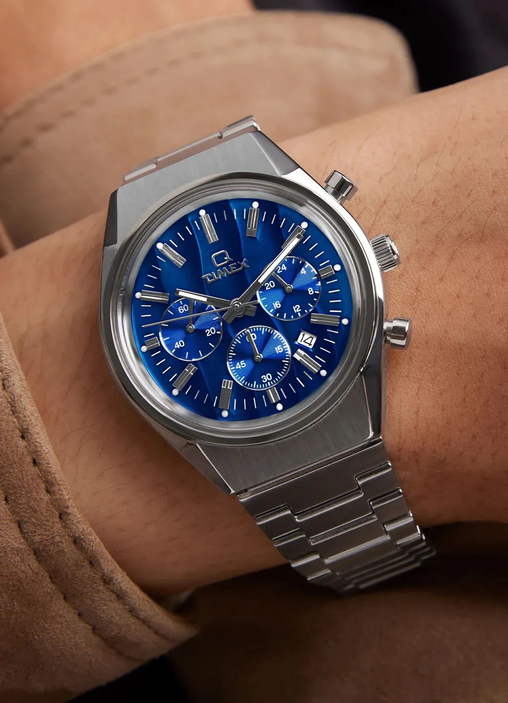 blue timex watch on persons wrist