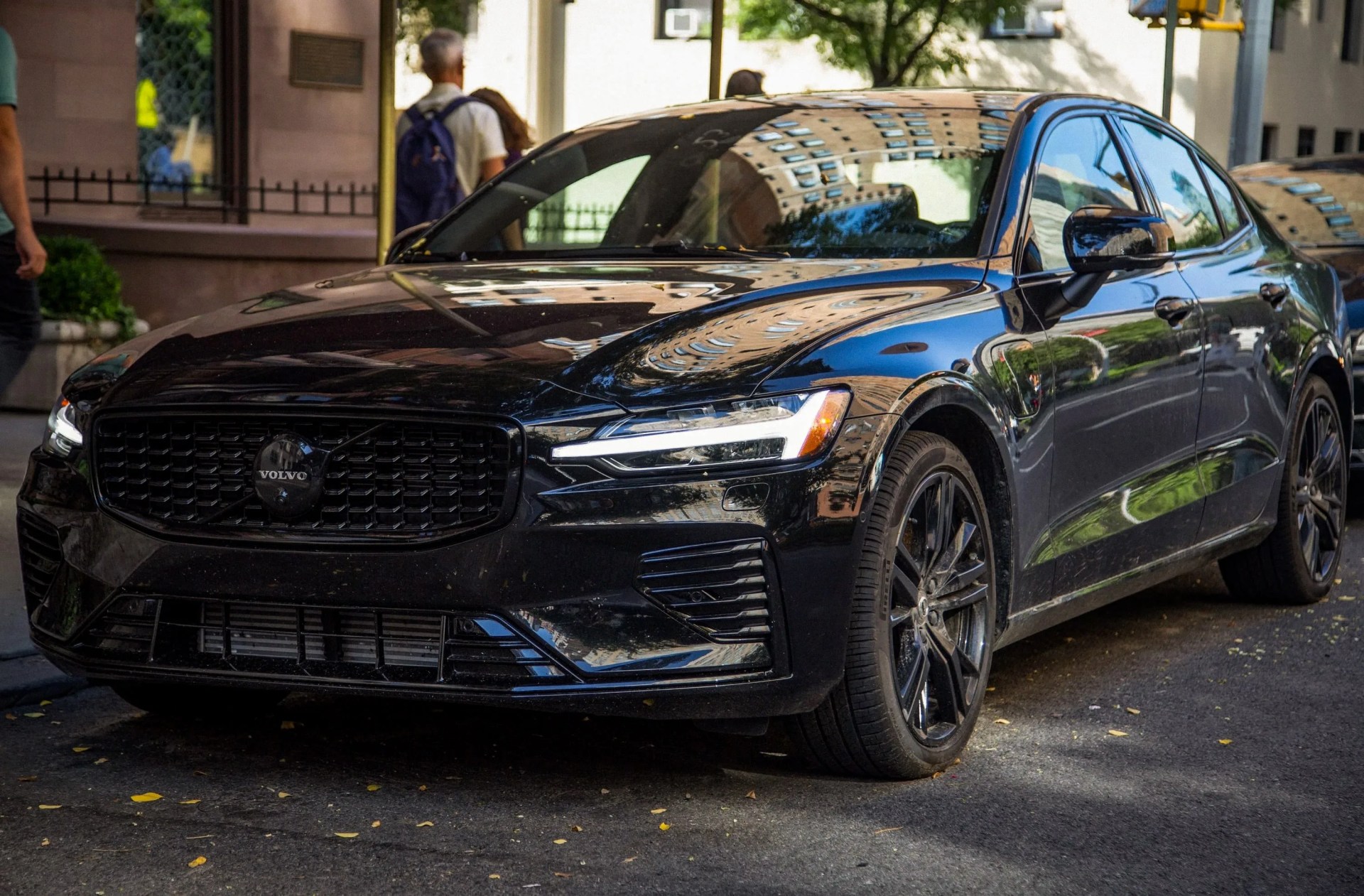 black Volvo parked on new york street