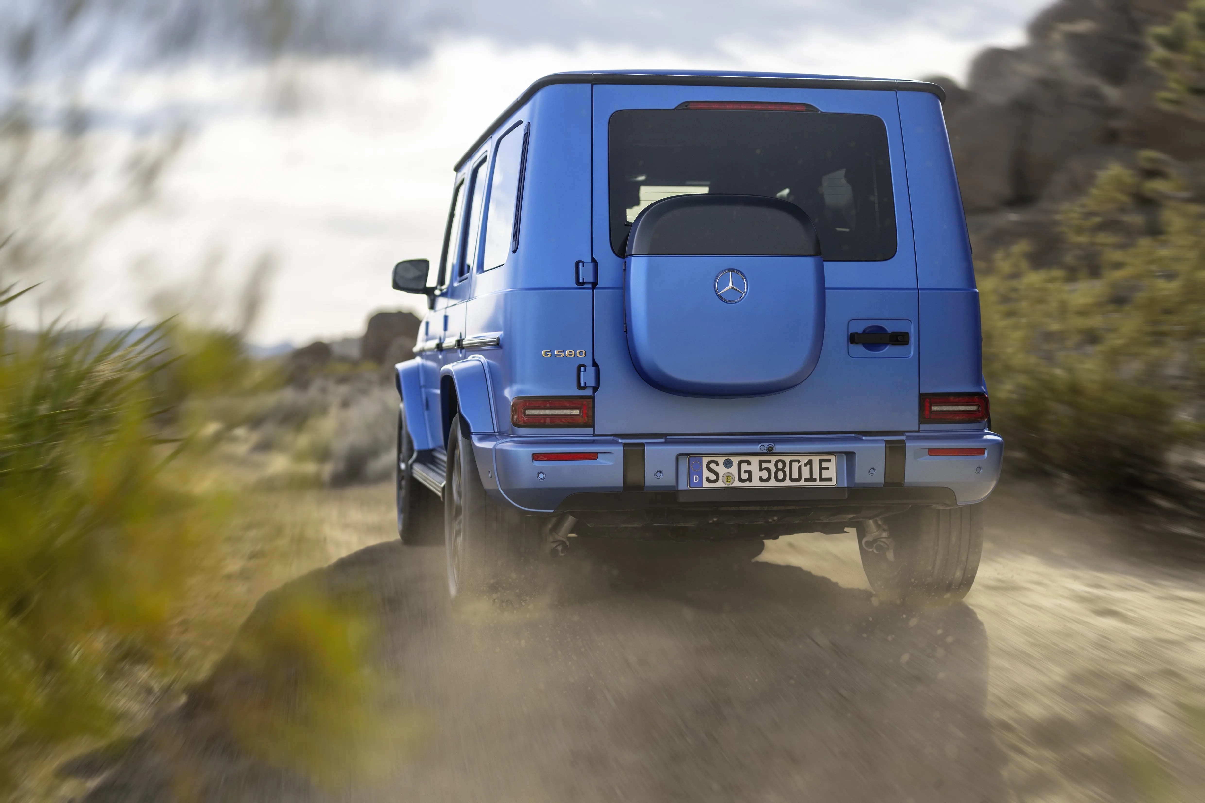 blue electric mercedes suv seen from the rear