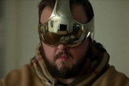 Screenshot of bearded man wearing futuristic metallic headset from the Netflix TV show 3 Body Problem
