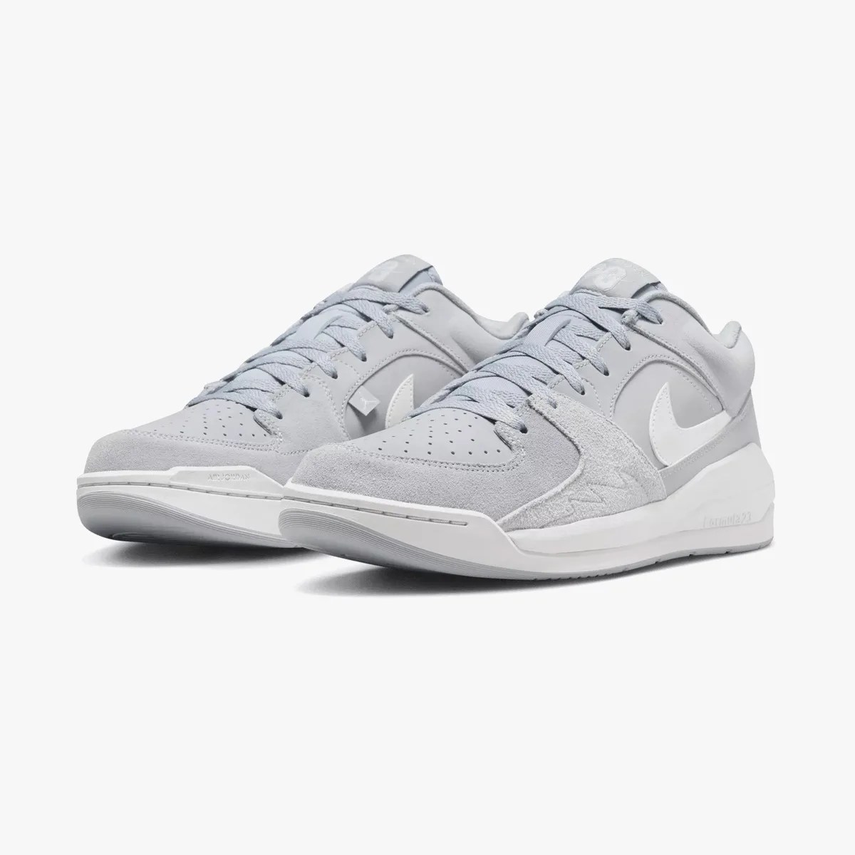 Jordan Stadium 90 sneaker pair viewed from side in grey white