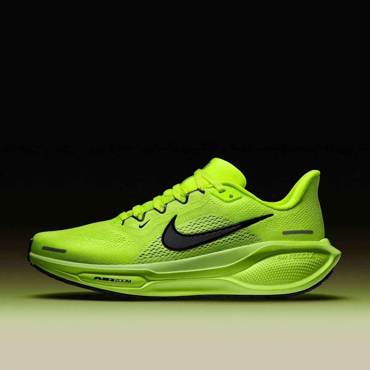 Nike Pegasus 41 running shoe in volt yellow color in profile on black and yellow background