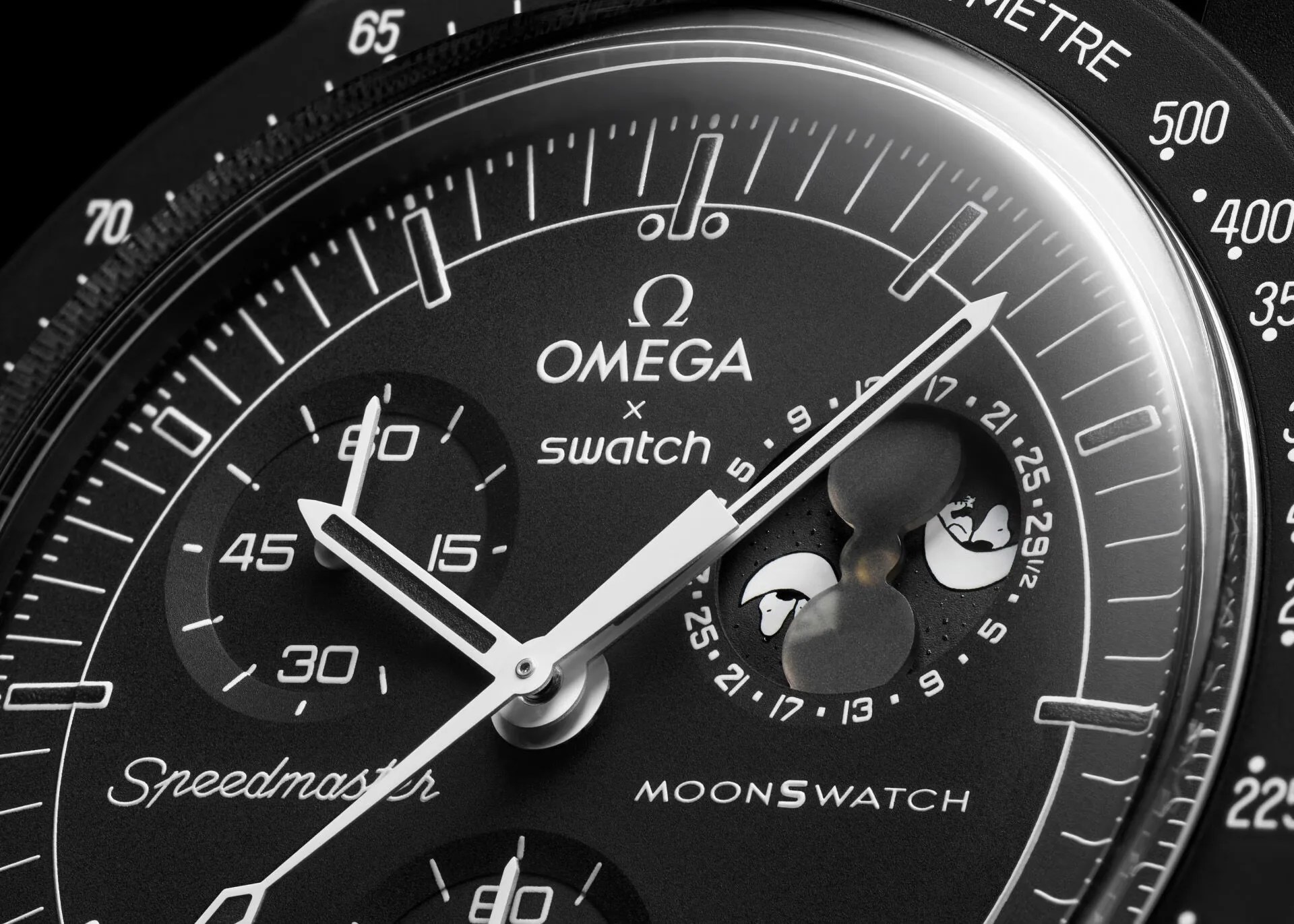 A close up image of the dial of the Swatch x Omega Mission to the moonphase New Moon showing the moonphase.  