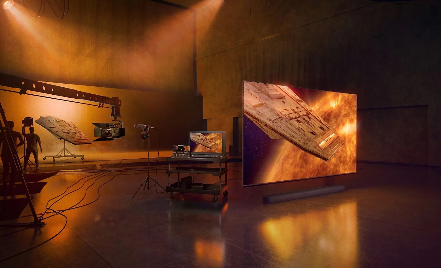 Rendering of a Sony Bravia 9 Mini LED TV on a professional movie set sitting next to a profession mastering monitor and in front of a movie film set. 