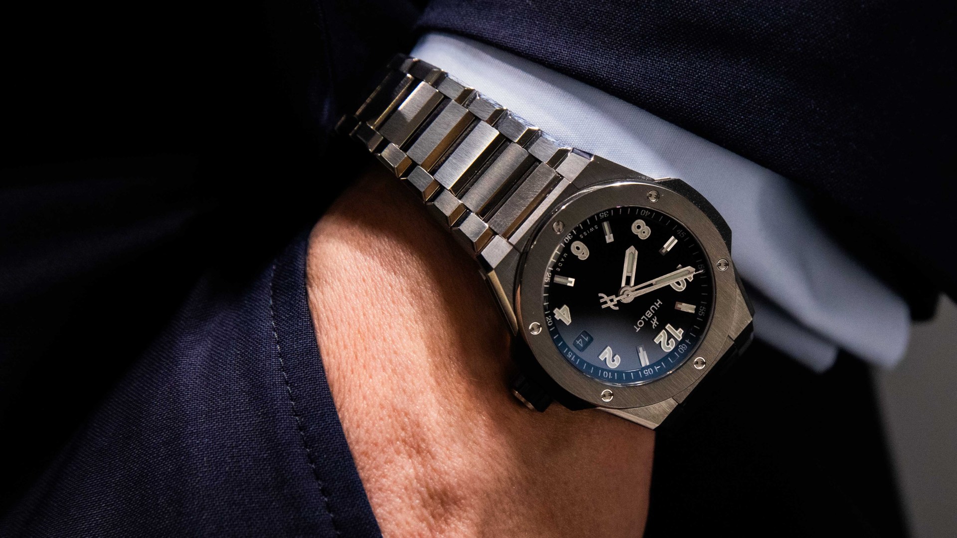 steel watch on man's wrist