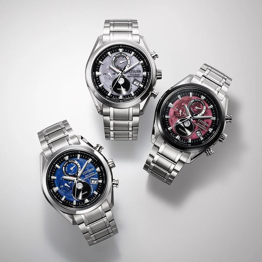 three citizen moonphase watches on a table