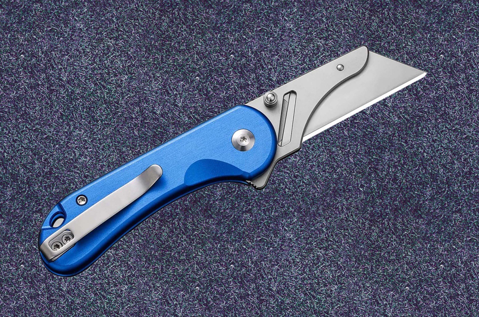utility knife on a gray textured background