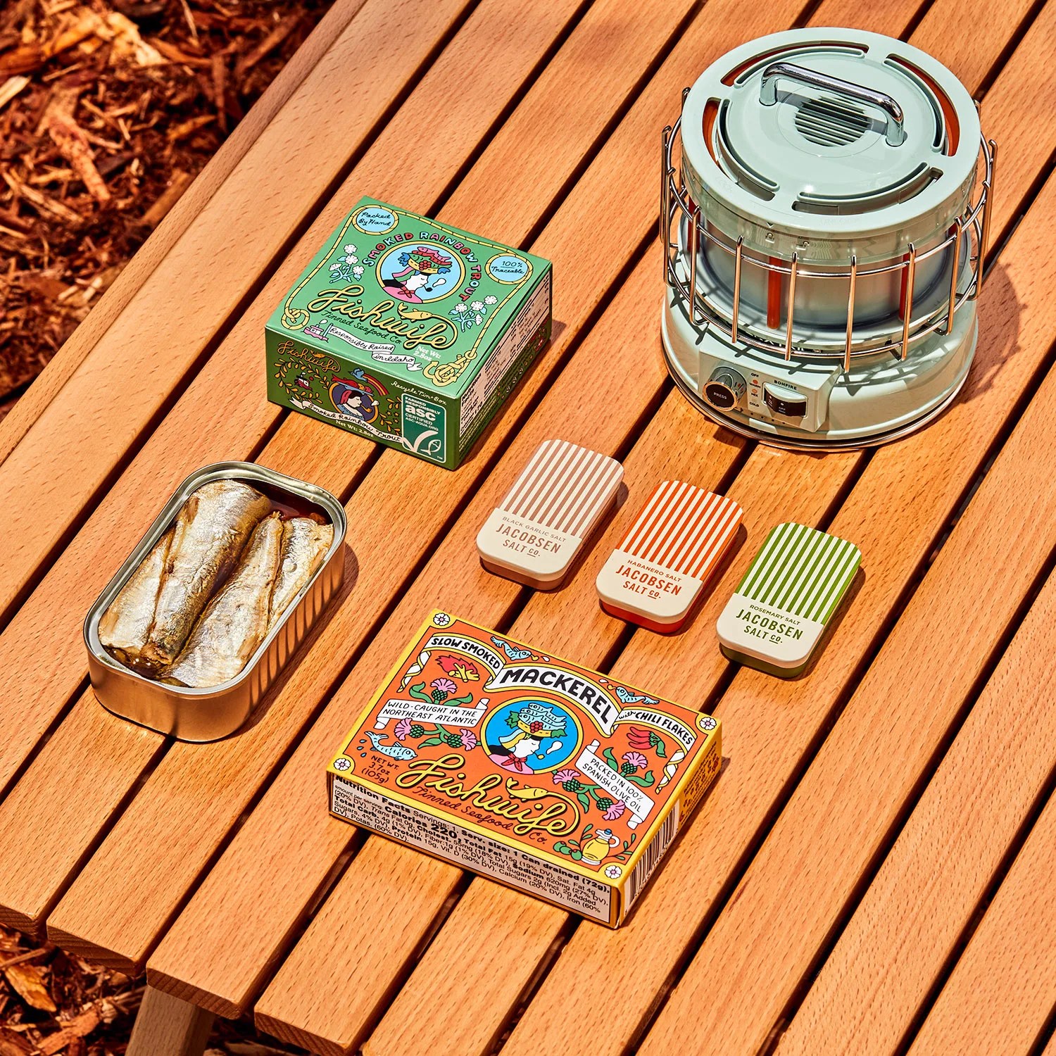 camp cooking items on slated wood surface